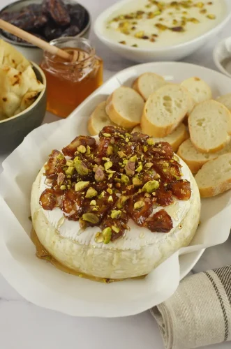 Baked Brie with Hot Honey, Pistachios and Dates